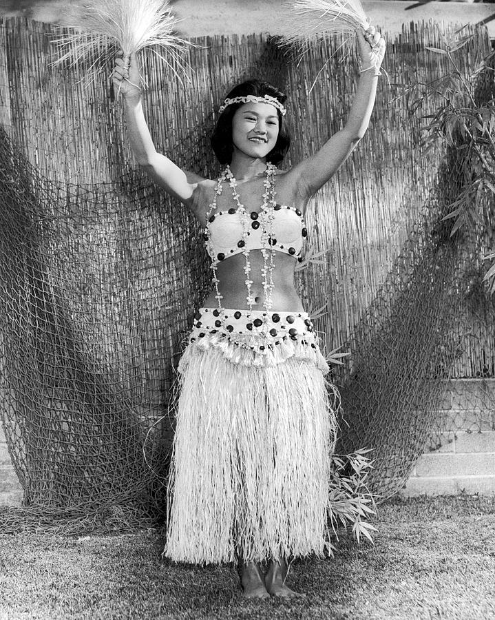 Black And White Photograph - A Young Hawaiian Hula Woman by Underwood Archives