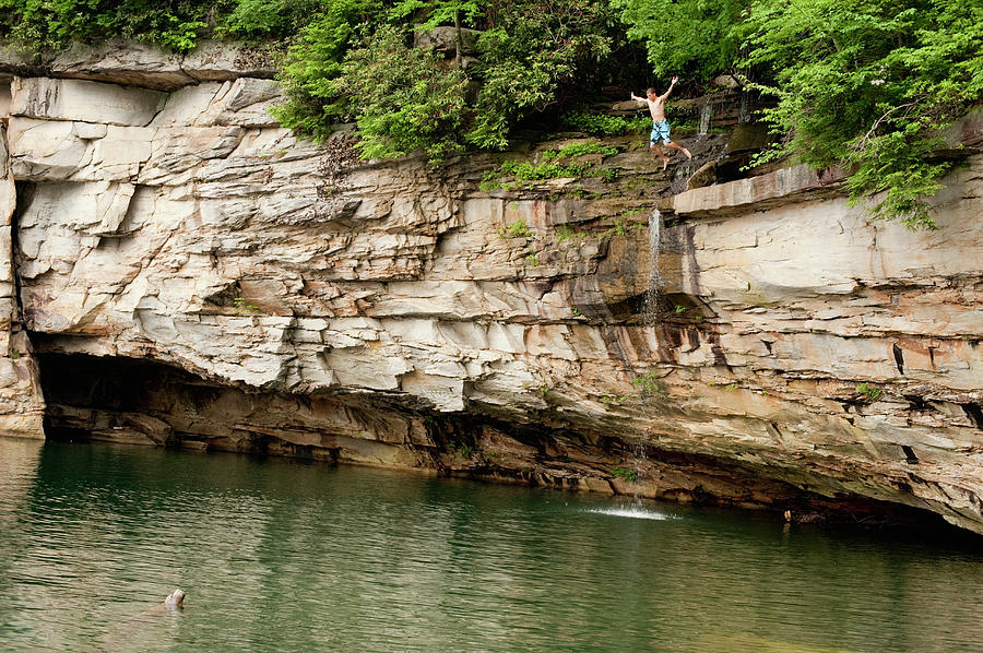 A Young Man Cliff Jumping Photograph by Ryan Rombough | Fine Art America