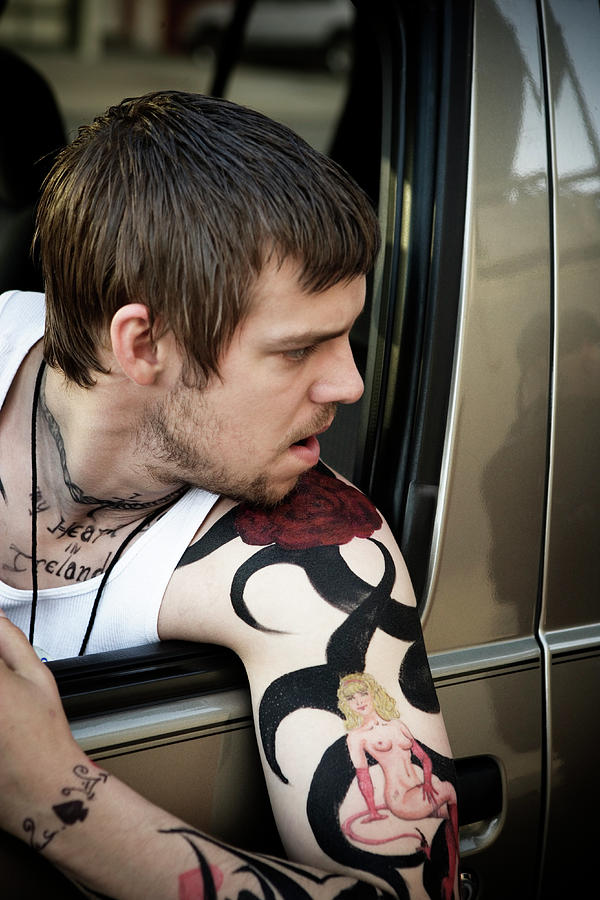 Adult Photograph - A Young Man With A Tattoed Arm Hanging by Ron Koeberer Adult Photograph - A Young Man With A Tattoed Arm Hanging by Ron Koeberer