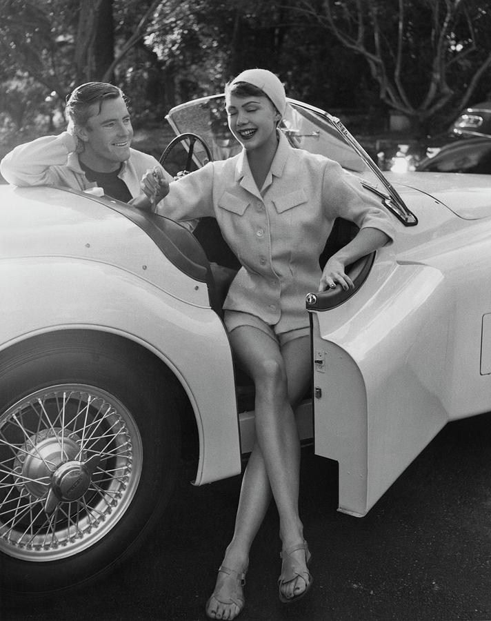 Transportation Photograph - A Young Model Sitting In A Convertible Sports Car by Karen Radkai