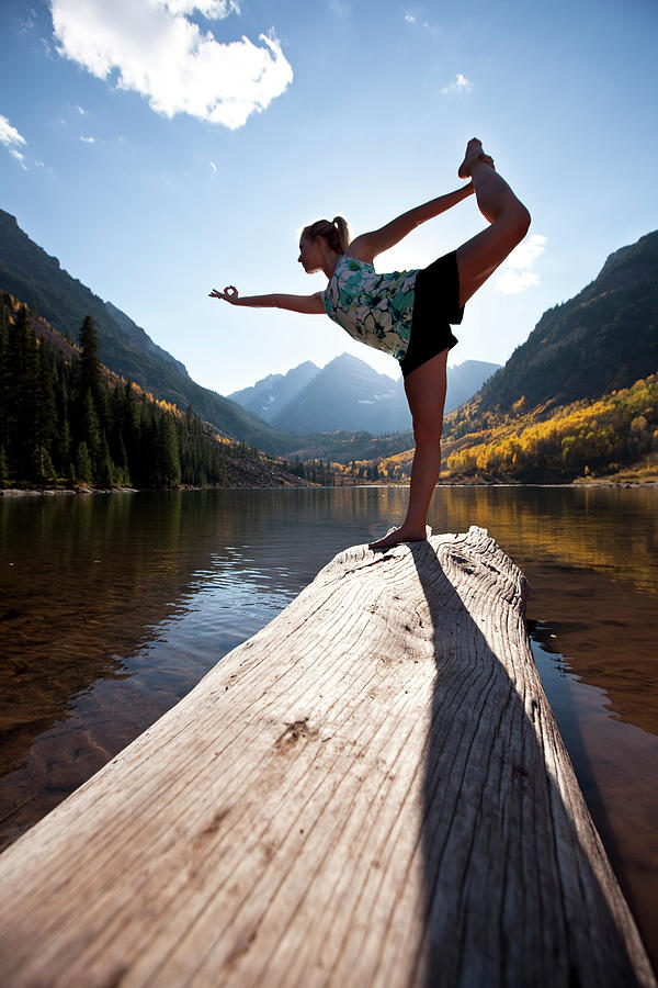 Fall Photograph - A Young Woman Doing Yoga Next To A Lake by Patrick Orton