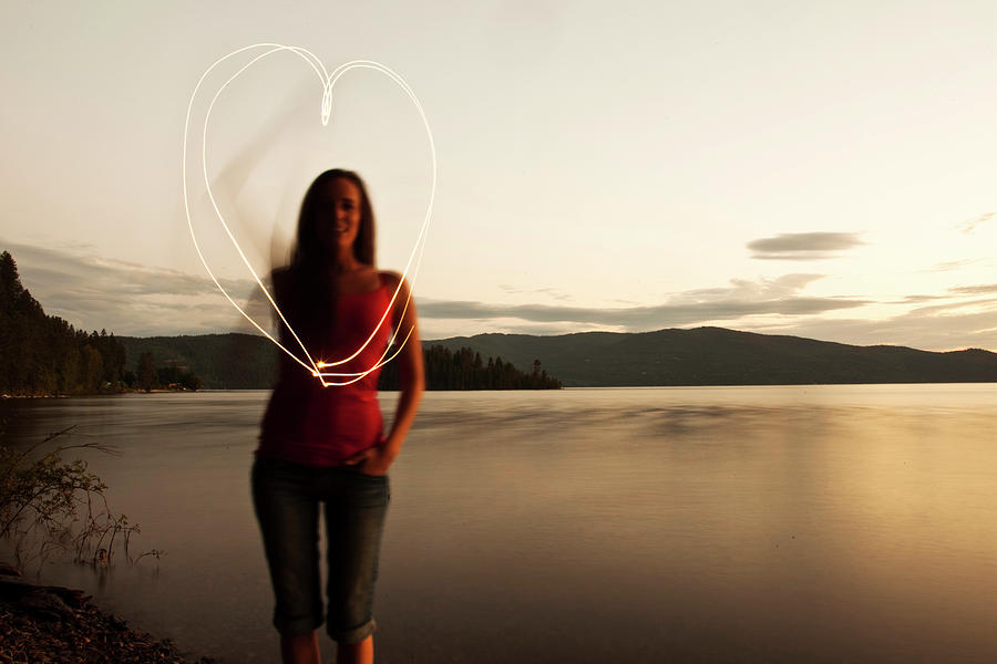 A Young Woman Drawing A Heart At Sunset Photograph by Patrick Orton ...