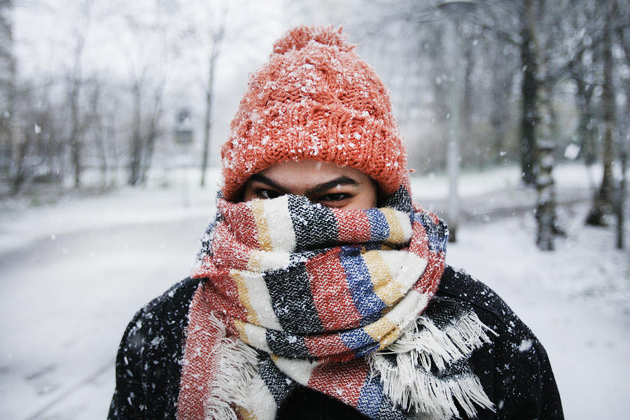 A young woman enjoying snowfall in Amsterdam Photograph by Paulo Amorim