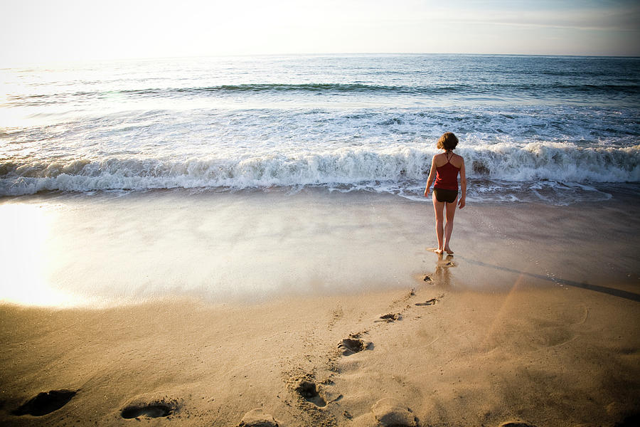 A Young Woman Walks Away Photograph by Michael Hanson - Fine Art America