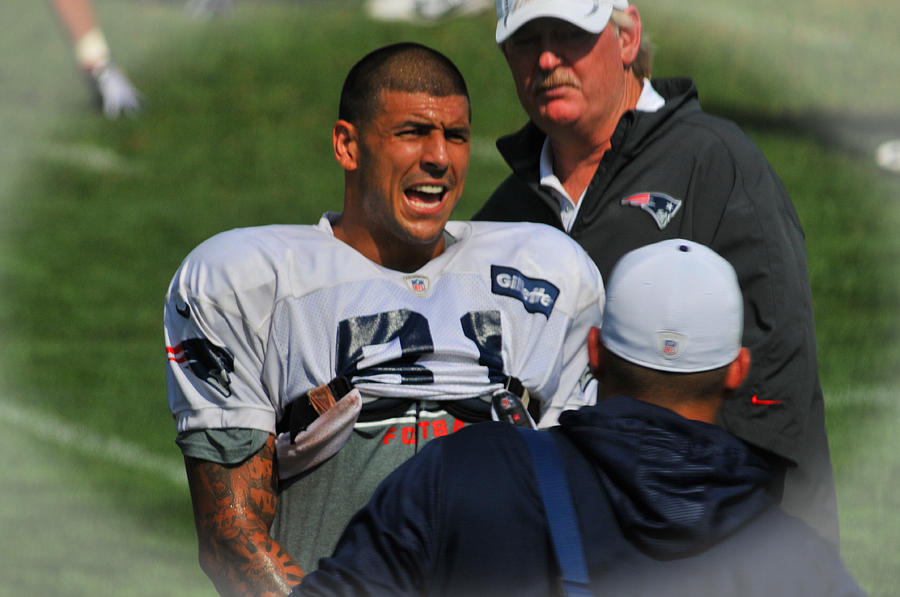 Aaron Hernandez with Patriots Coaches Photograph by Mike Martin