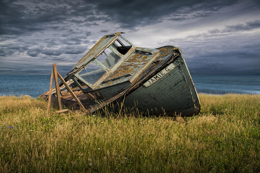 Abandoned and Forlorn a Ship Wreck lies on Prince Edward Island Photograph by Randall Nyhof
