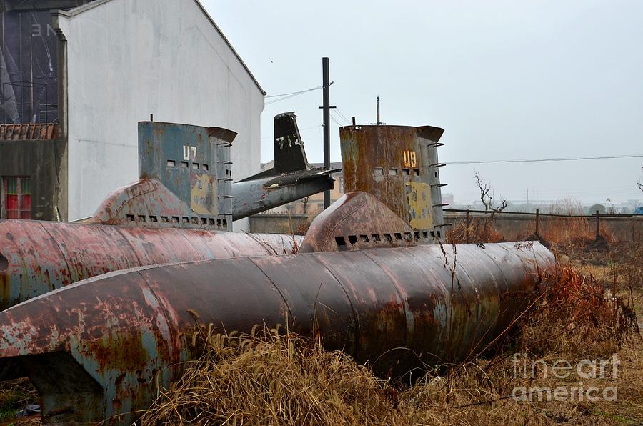 Airplane Photograph - Abandoned obsolete submarines and airplane in junkyard by Imran Ahmed
