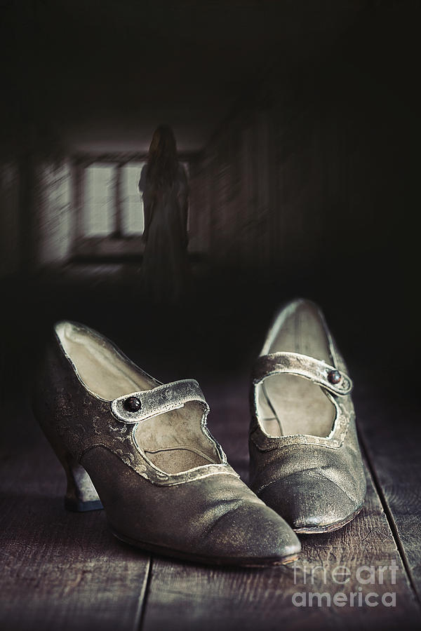 Abandoned pair of old shoes left on wooden floor Photograph by Sandra Cunningham