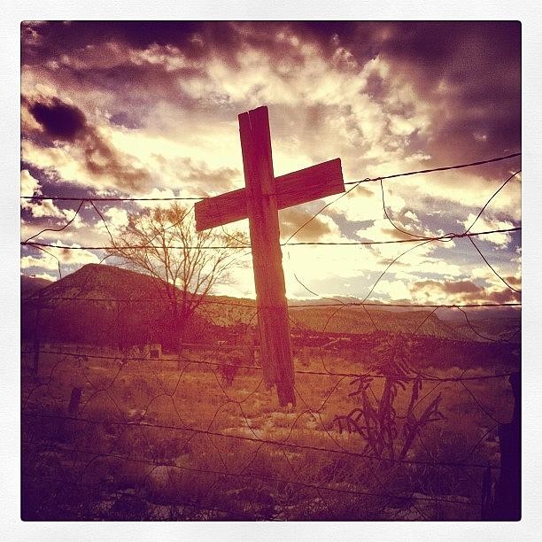Sunset Photograph - Abiquiu Cross and Fence by Sylvia Anderson