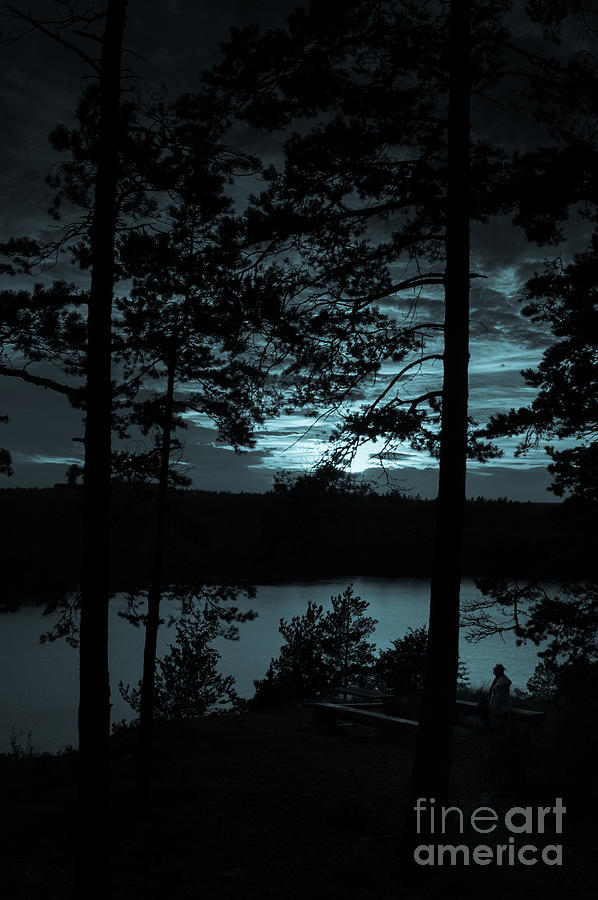 Aboda Klint lake Sweden moonlight effect with female sitting  Photograph by Peter Noyce