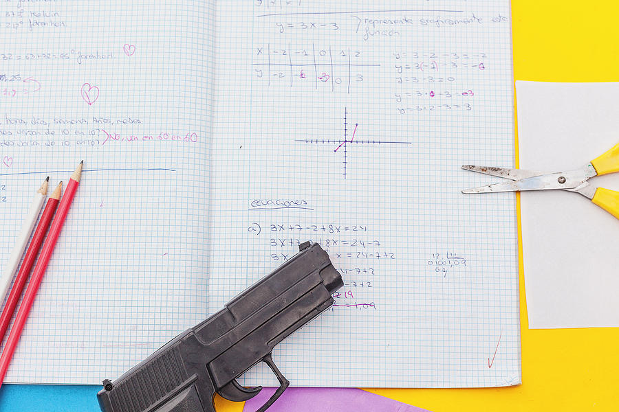 Above View Student Notebook And Handgun Photograph by Carol Yepes