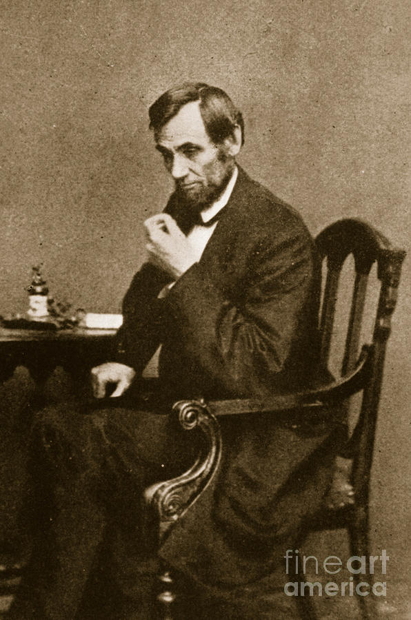 Abraham Lincoln Photograph - Abraham Lincoln Sitting at Desk by Mathew Brady
