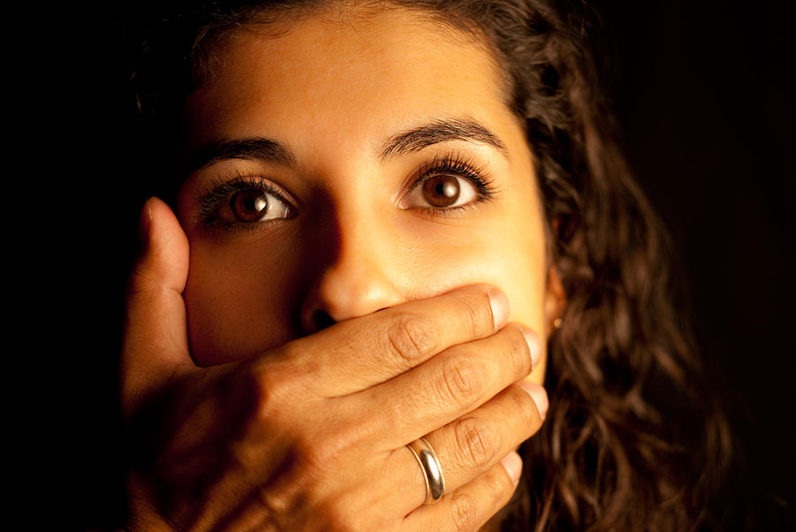 Abused Woman being silenced Photograph by AndresCalle