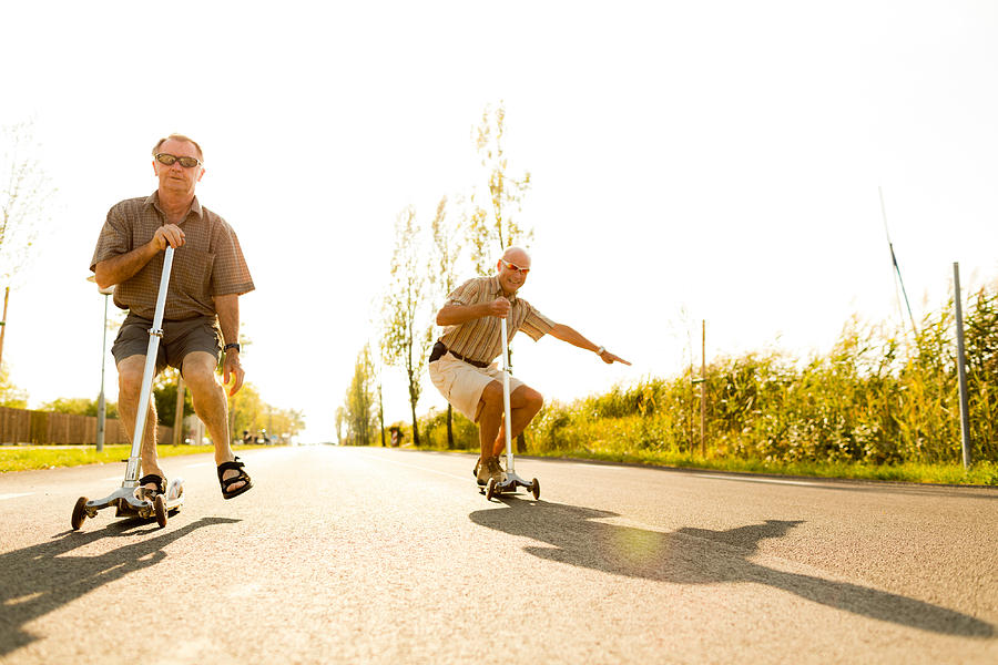 Active Seniors On Kickboards Photograph by Amriphoto