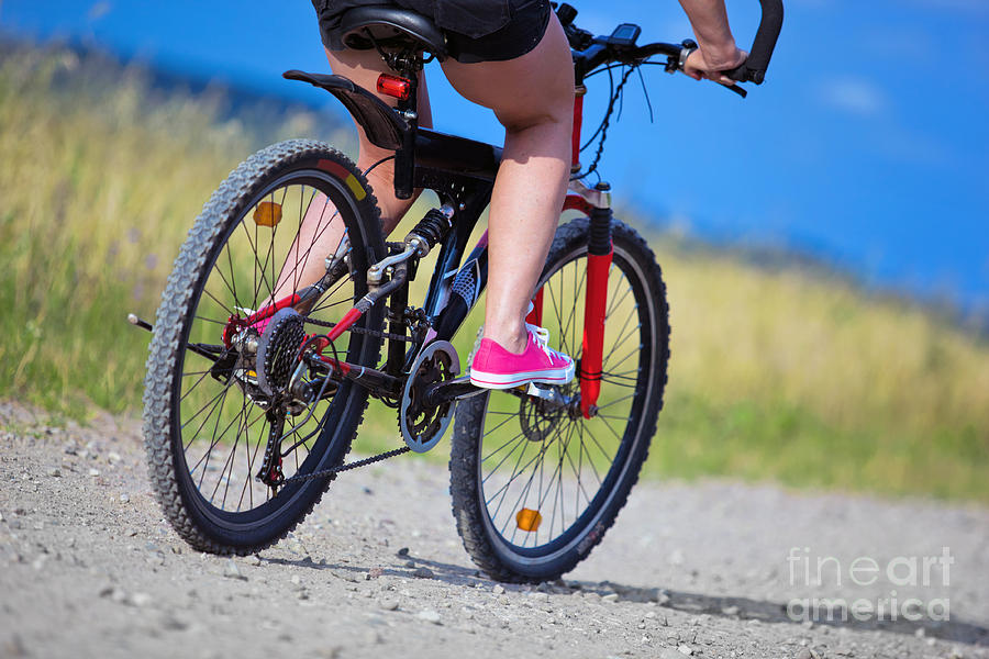 Summer Photograph - Active woman on a bike by Michal Bednarek