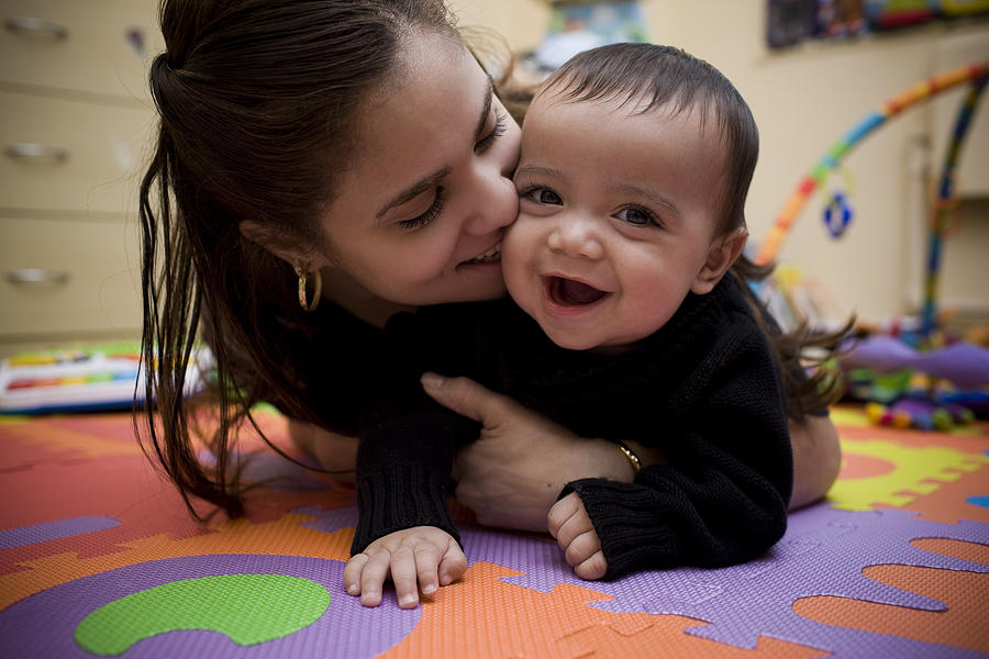 Adorable Hispanic Young Mother and Son in Home Playroom Photograph by Quavondo