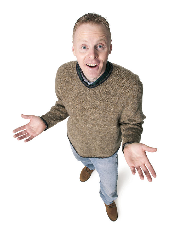 Adult Caucasian Man Dressed In Jeans And Green Sweater Gestures With His Hands Shrugs His Shoulders Photograph by Photodisc