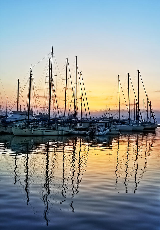 Aegina harbour sunset Photograph by Paul Cowan