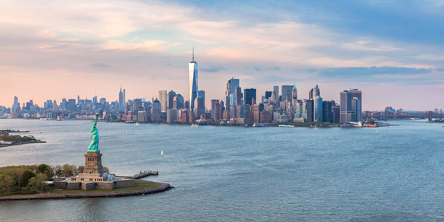 Aerial of Statue of Liberty and Manhattan skyline Photograph by Matteo Colombo