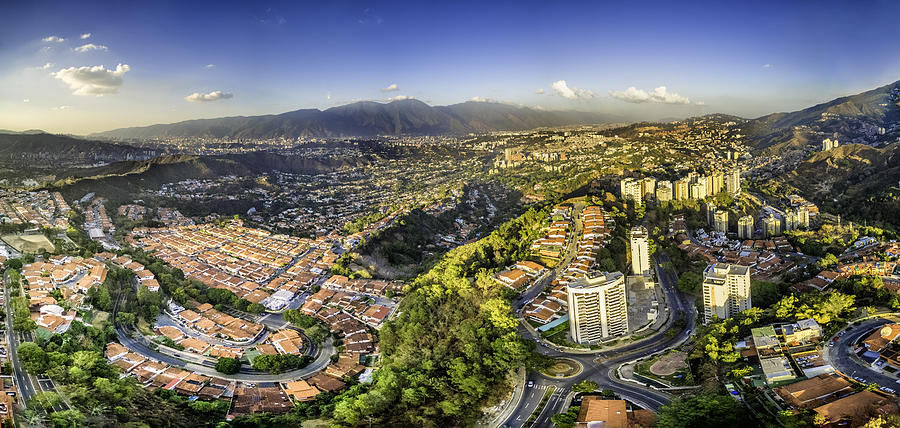Aerial Panoramic image of Caracas city view with El Avila Photograph by Apomares