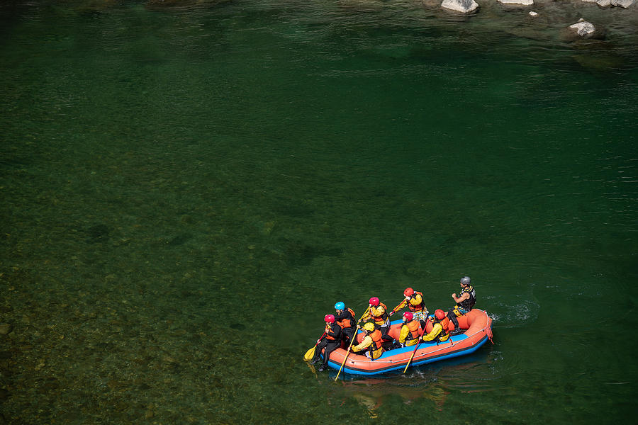 Aerial view of a group men and women rafting in a calm river Photograph by Tdub303