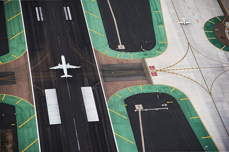 Aerial View of a Passenger Jet on the Runway Photograph by Art Wager