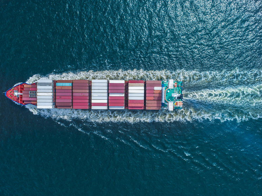 Aerial view of  container ship in sea Photograph by Michael H