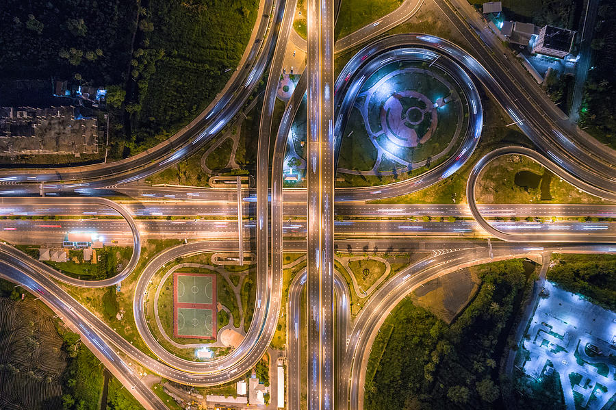 Aerial view of infinity road intersection at night. Photograph by Beerpixs