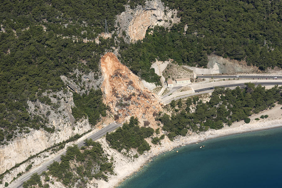 Aerial View of Landslides on road near the seaside Photograph by Gece33