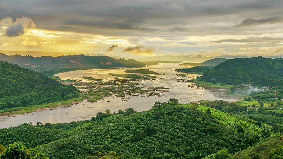 Aerial View Of Mekong River And Forest by Jakkreethampitakkull