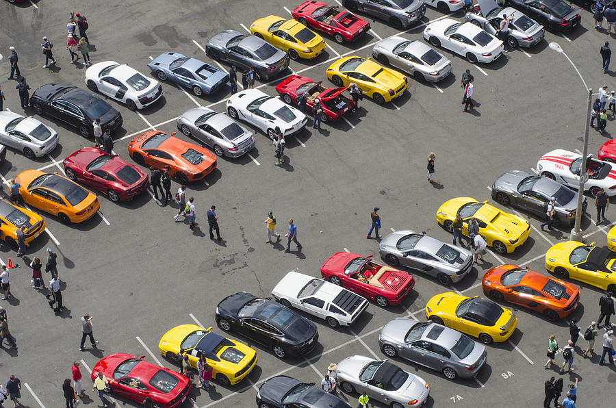 Aerial view of people walking in parking lot Photograph by Chris Sattlberger