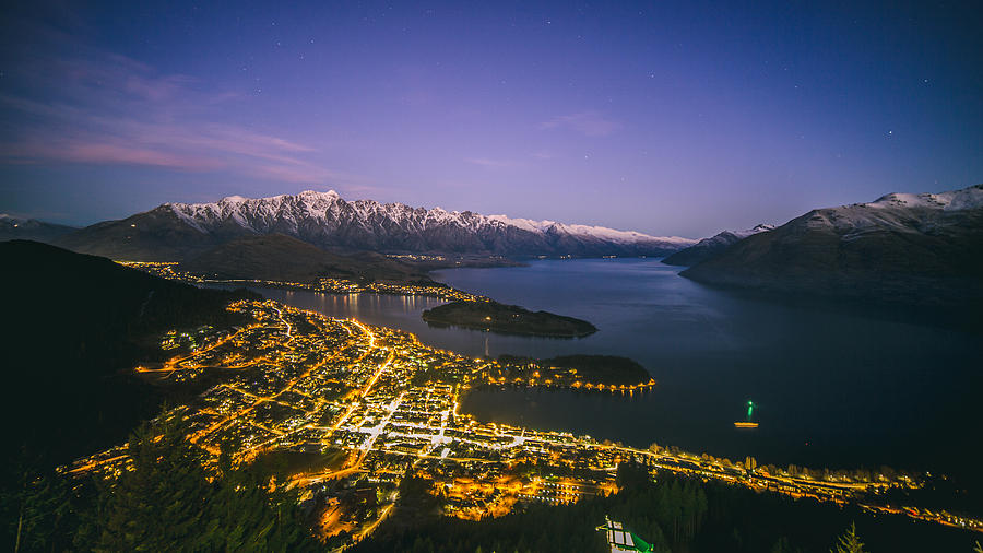 Aerial view of Queenstown cityscape at night, New Zealand Photograph by Lingxiao Xie