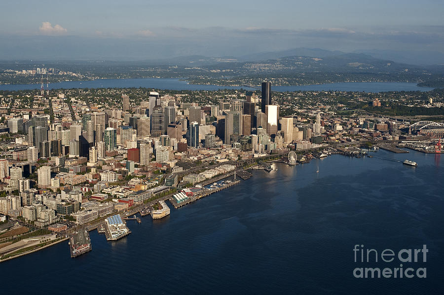 Aerial view of Seattle skyline with Elliott Bay and ferry boat Photograph by Jim Corwin