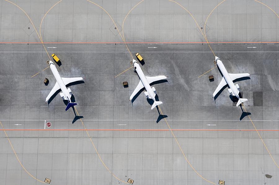 Aerial view of three airplanes in a row Photograph by fStop Images - Stephan Zirwes