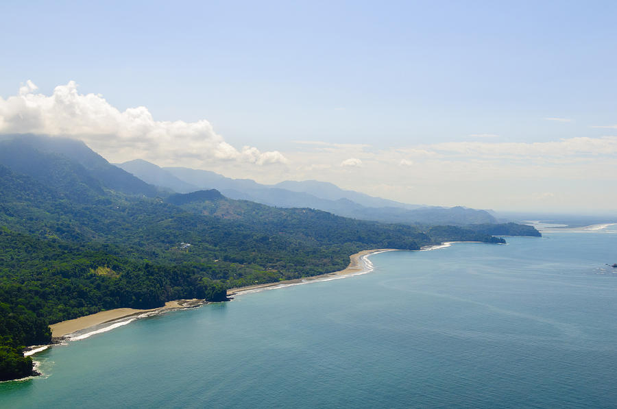 Aerial view of tropical forests from mountains to coast. Photograph by OGphoto