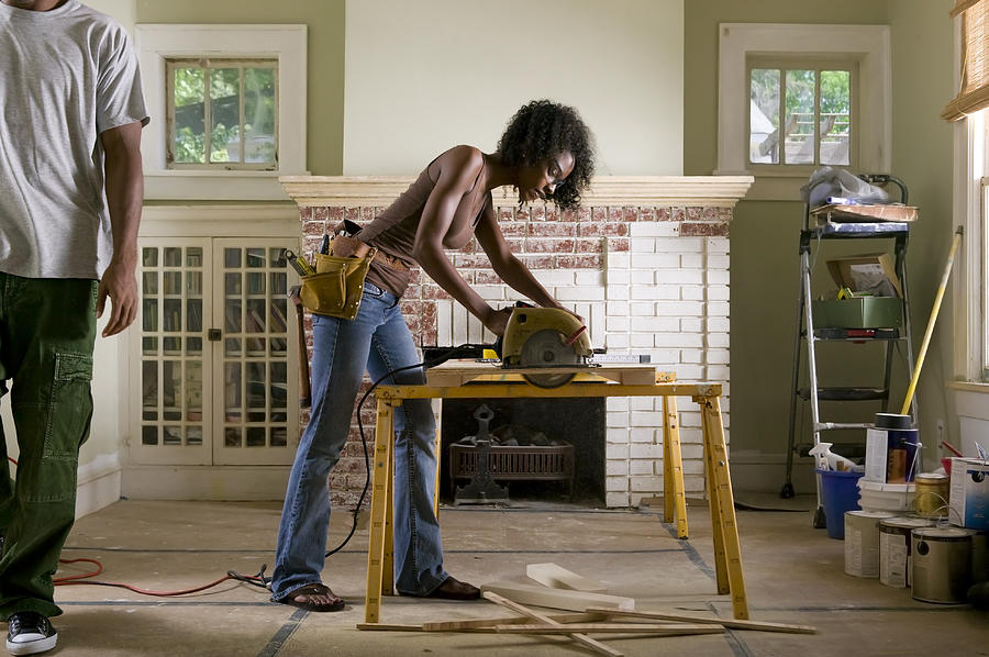 African American couple renovating home interior. Photograph by Phillipspears