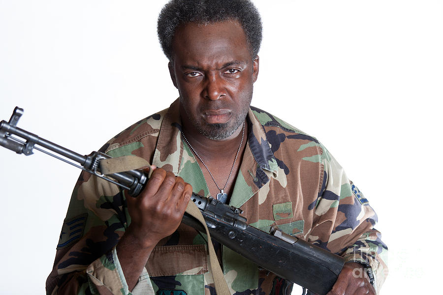 Knife Still Life Photograph - African American man with gun by Gunter Nezhoda