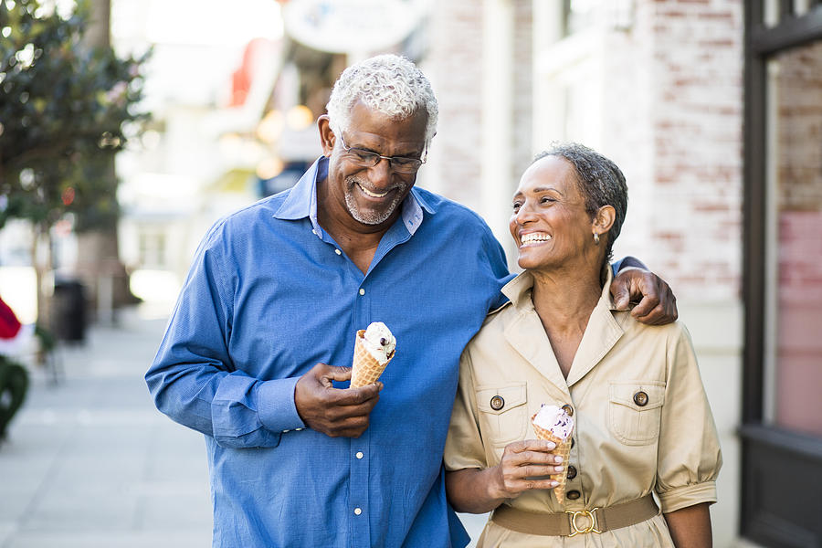 African American Senior Couple On the Town with Ice Cream Photograph by Adamkaz