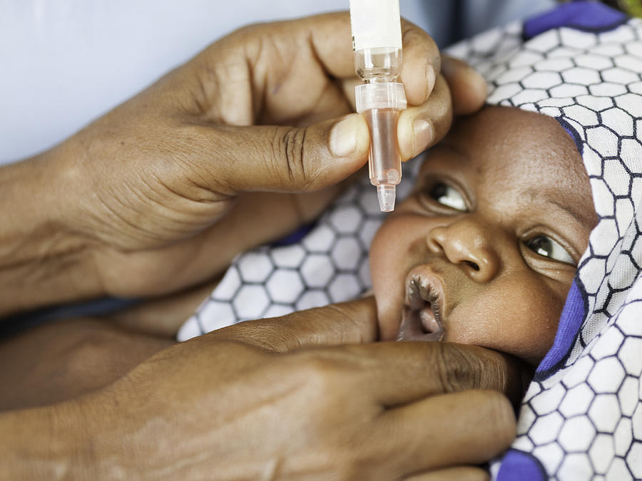 African Baby Receiving Vaccine Photograph by Ranplett