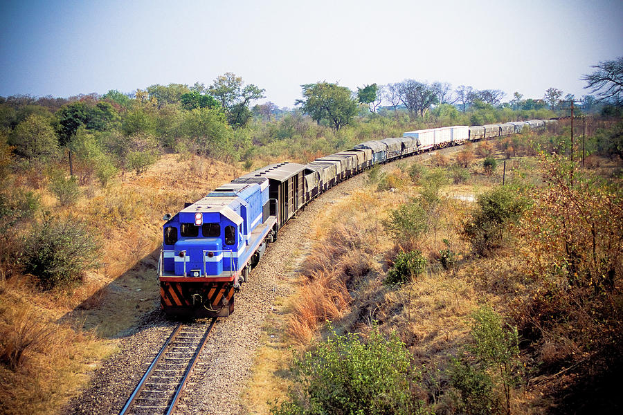 African Cargo Train Between Zimbabwe Photograph by Beyondimages