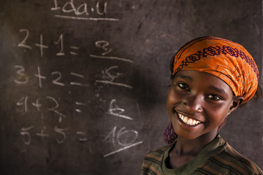 African little girl during math class, southern Ethiopia, East Africa Photograph by Bartosz Hadyniak