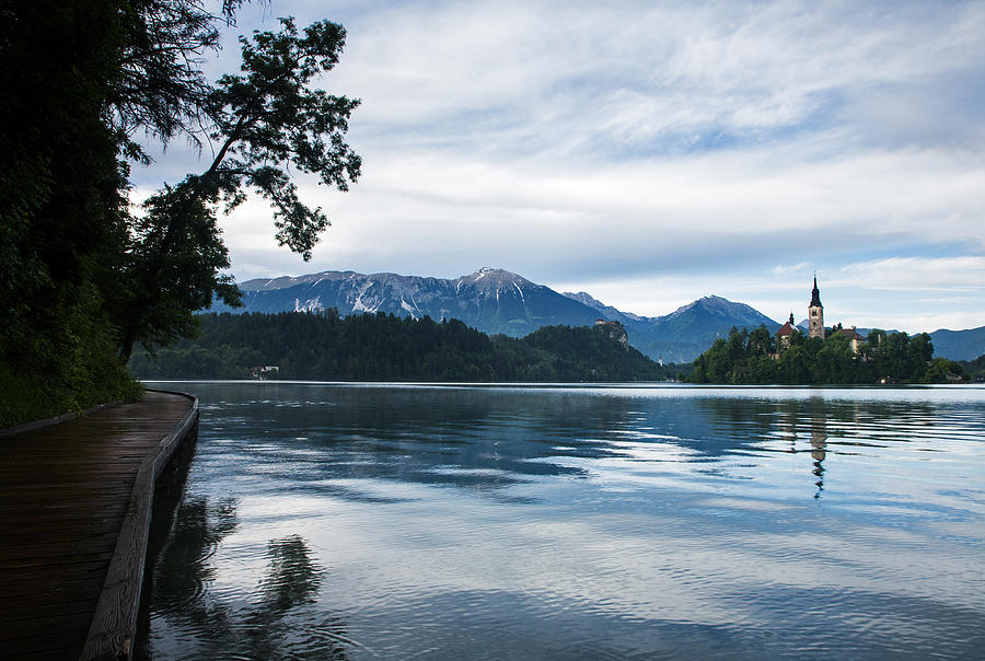 After storm light over Lake Bled Photograph by Ian Middleton