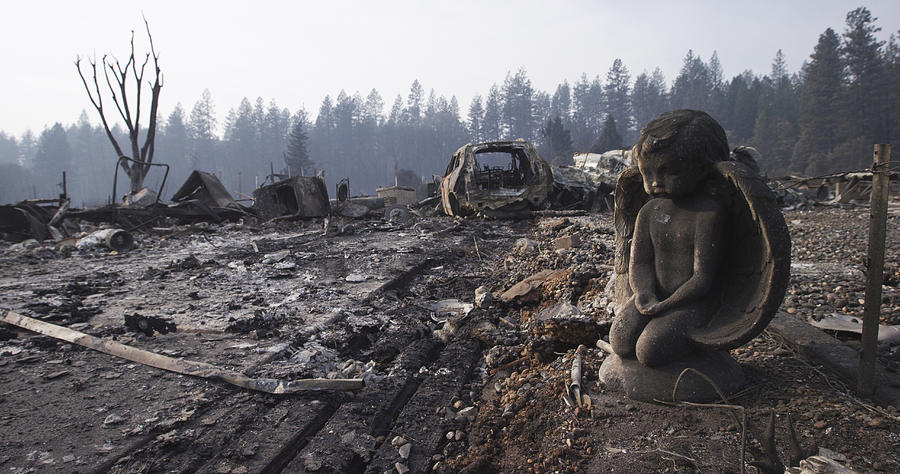 After the Fire Destroyed Everything, A Stone Sculpture of an Angel Endures, Watching over the Ash, Rubble, and Wrecked Vehicle in the Neighborhood Photograph by Justin Lewis