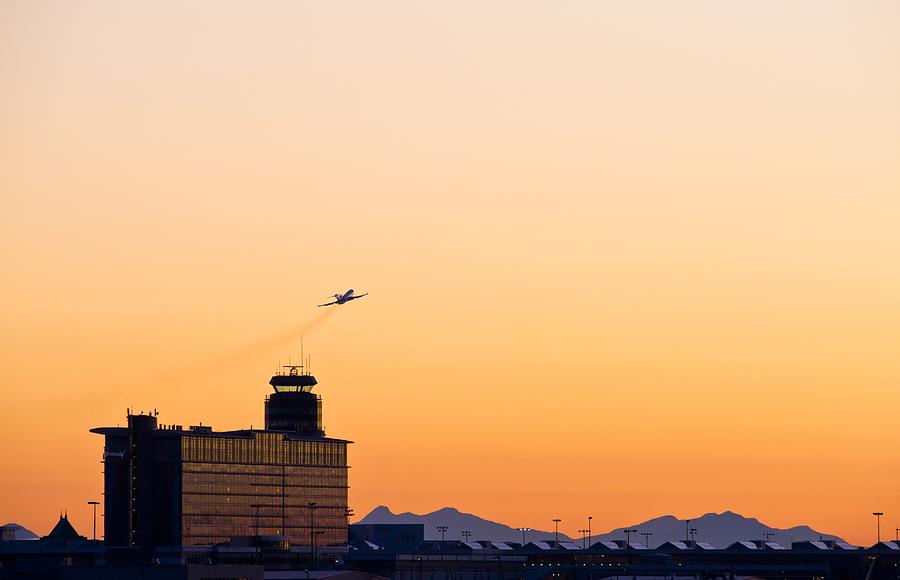 Sunset Photograph - Aircraft taking off by Science Photo Library