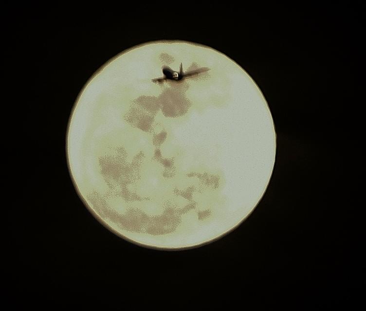 Airplane Crossing Moon Photograph by Linda Brody
