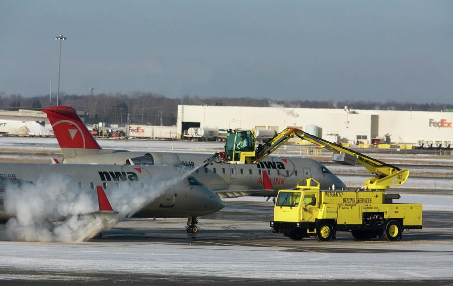 Airplane De-icing Photograph by Jim West