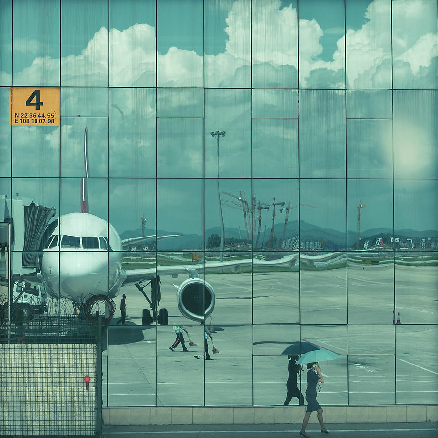 Airplane Reflections And Umbrella Photograph by Capturing A Second In Life, Copyright Leonardo Correa Luna