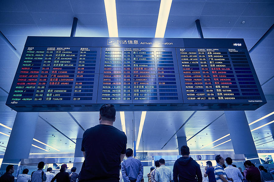 Airport arrivals and departure board Photograph by Christian Petersen-Clausen