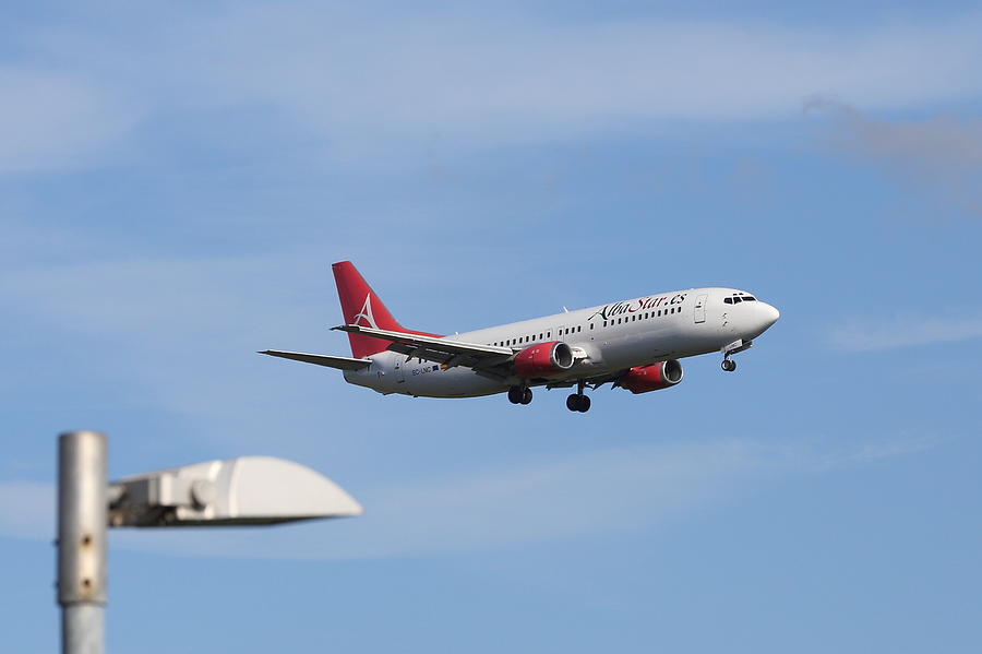 AlbaStar Passenger jet landing at Gatwick Airport Photograph by Pejft