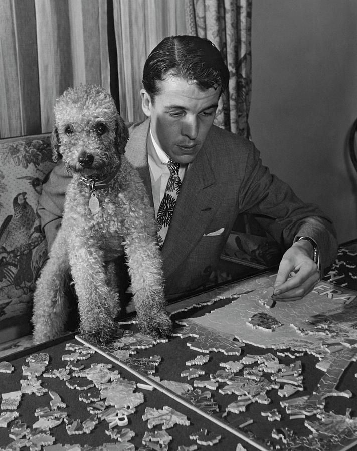 Alfred Gwynne Vanderbilt Completing A Puzzle Photograph by John Swope